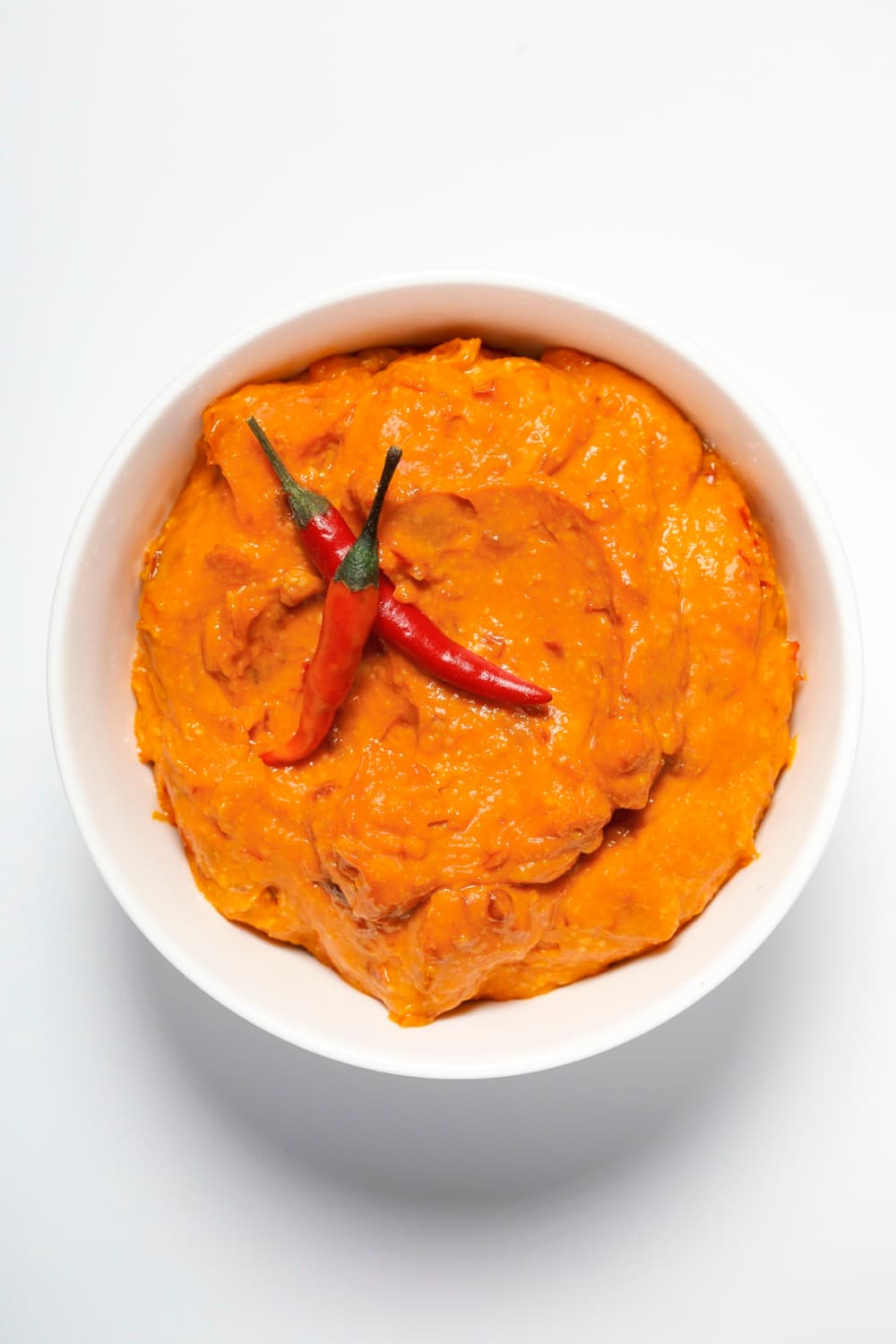 Bowl of Smart Gourmet Chili Toum with red chilis