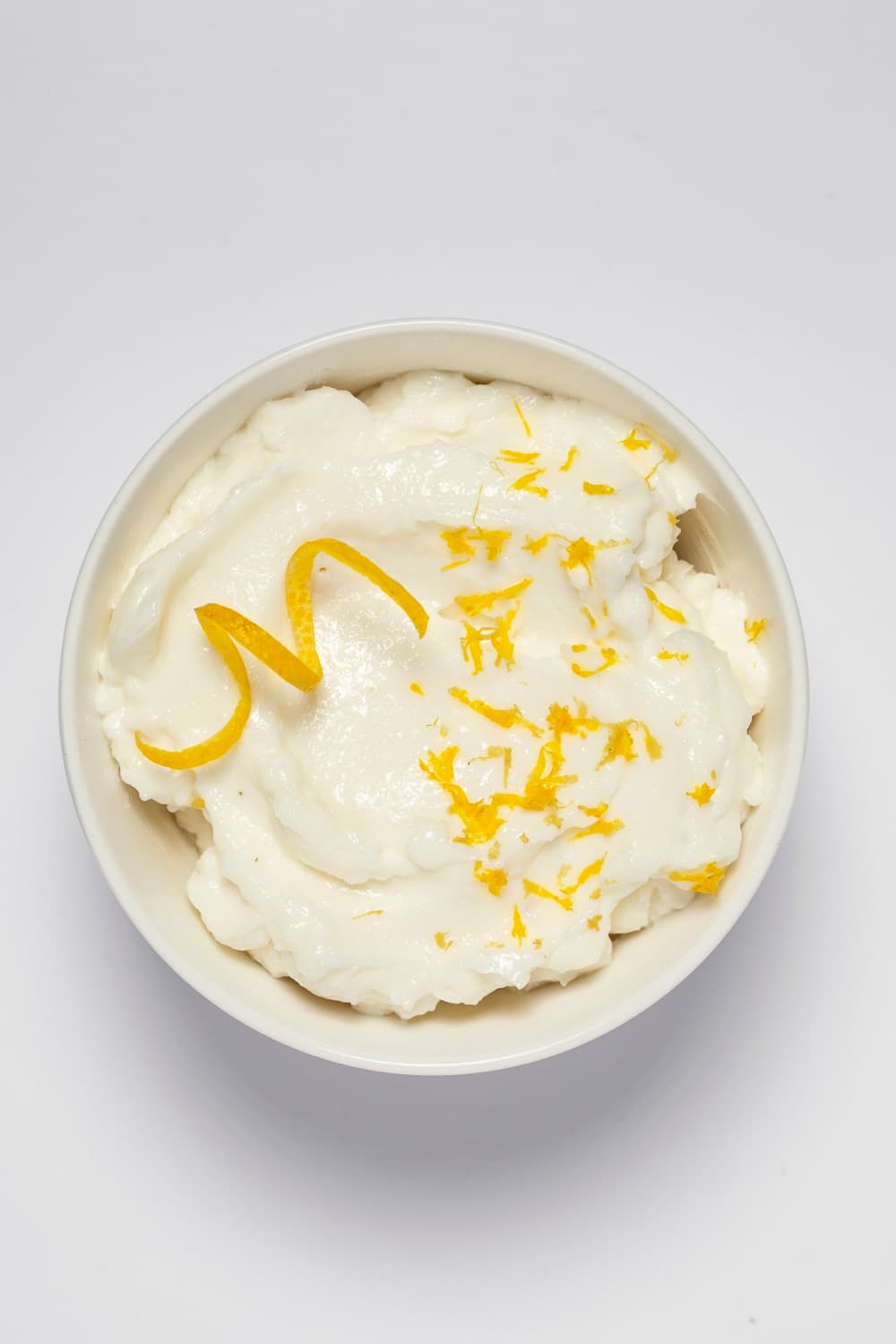 Bowl of Smart Gourmet Garlic Paste with lemon zest