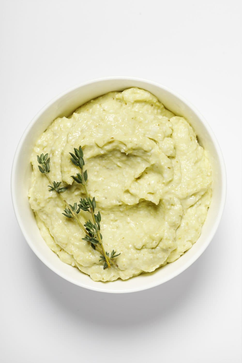 Bowl of Smart Gourmet Mustard Toum with herbs